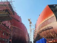 Workers produce ship hulls at Tuangang Community Shipbuilding base in Yanweigang town, Guanyun County, Lianyungang, China, on October 29, 20...