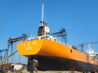 Workers produce ship hulls at Tuangang Community Shipbuilding base in Yanweigang town, Guanyun County, Lianyungang, China, on October 29, 20...