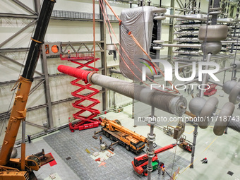 Power maintenance personnel overhaul the equipment of Guquan converter station in Xuancheng, China, on October 29, 2024. (