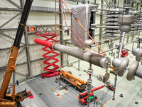 Power maintenance personnel overhaul the equipment of Guquan converter station in Xuancheng, China, on October 29, 2024. (