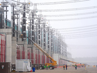 Power maintenance personnel overhaul the equipment of Guquan converter station in Xuancheng, China, on October 29, 2024. (