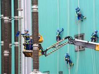 Power maintenance personnel overhaul the equipment of Guquan converter station in Xuancheng, China, on October 29, 2024. (