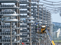 Power maintenance personnel overhaul the equipment of Guquan converter station in Xuancheng, China, on October 29, 2024. (