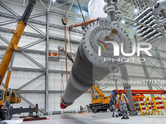 Power maintenance personnel overhaul the equipment of Guquan converter station in Xuancheng, China, on October 29, 2024. (