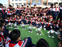 Primary school students watch a dancing robot performance in Handan, China, on October 29, 2024. (