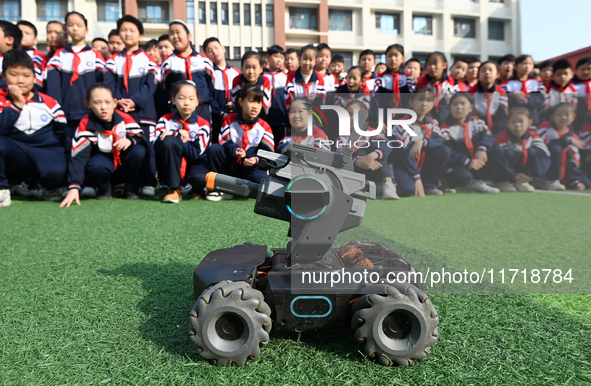 Elementary school students watch the Mech Master in Handan, China, on October 29, 2024. 