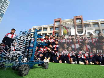 In Handan, China, on October 29, 2024, primary school students look at maker works in Handan, North China's Hebei province. (