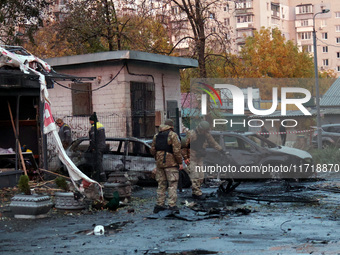 In Kyiv, Ukraine, on October 29, 2024, law enforcers pick up the fragments of a Russian UAV after a Russian drone attack. Six people are inj...