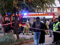 Rescuers stand by a fire engine in the Solomianskyi district after a Russian drone attack in Kyiv, Ukraine, on October 29, 2024. Six people...