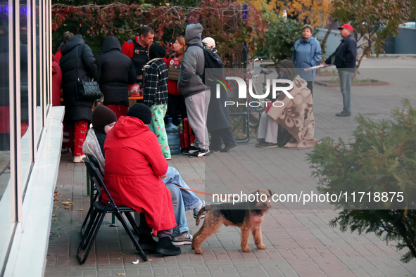 People affected by a Russian drone attack stay outdoors in Kyiv, Ukraine, on October 29, 2024. Six people are injured, and 15 people are eva...