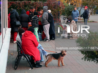 People affected by a Russian drone attack stay outdoors in Kyiv, Ukraine, on October 29, 2024. Six people are injured, and 15 people are eva...