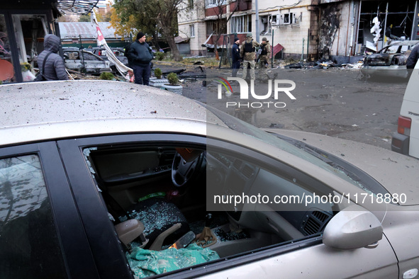 A car is damaged by a Russian drone attack in Kyiv, Ukraine, on October 29, 2024. Six people are injured, and 15 people are evacuated as a r...