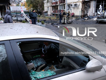 A car is damaged by a Russian drone attack in Kyiv, Ukraine, on October 29, 2024. Six people are injured, and 15 people are evacuated as a r...