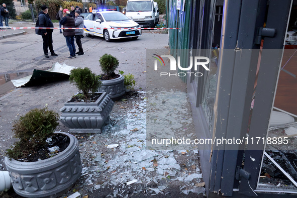 Glass shards cover the ground at a flower shop in the Solomianskyi district damaged by a Russian drone attack in Kyiv, Ukraine, on October 2...