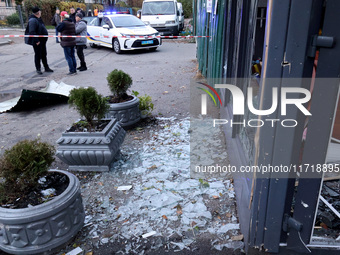 Glass shards cover the ground at a flower shop in the Solomianskyi district damaged by a Russian drone attack in Kyiv, Ukraine, on October 2...