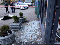 Glass shards cover the ground at a flower shop in the Solomianskyi district damaged by a Russian drone attack in Kyiv, Ukraine, on October 2...