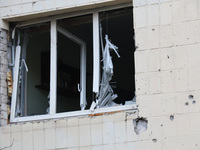 A shattered window is at an apartment block in the Solomianskyi district damaged by a Russian drone attack in Kyiv, Ukraine, on October 29,...