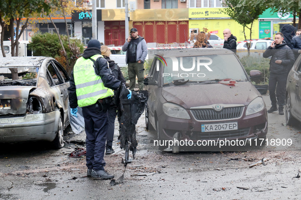 A police officer holds a piece of debris in the Solomianskyi district after a Russian drone attack in Kyiv, Ukraine, on October 29, 2024. Si...