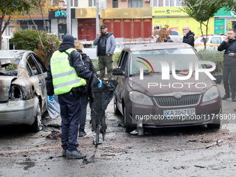 A police officer holds a piece of debris in the Solomianskyi district after a Russian drone attack in Kyiv, Ukraine, on October 29, 2024. Si...