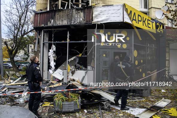 Experts inspect the site of a Russian drone strike in Kyiv, Ukraine, on October 29, 2024 