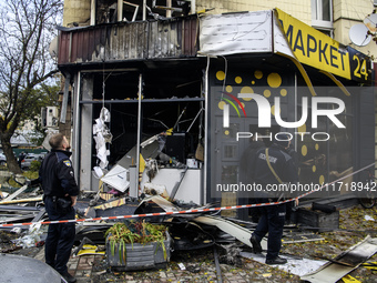 Experts inspect the site of a Russian drone strike in Kyiv, Ukraine, on October 29, 2024 (