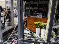 A woman inspects the damage to a flower shop after a Russian drone strike in Kyiv, Ukraine, on October 29, 2024 (