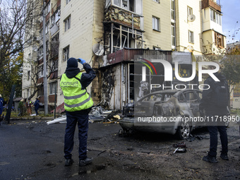 Experts inspect the site of a Russian drone strike near a residential building in Kyiv, Ukraine, on October 29, 2024 (