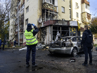 Experts inspect the site of a Russian drone strike near a residential building in Kyiv, Ukraine, on October 29, 2024 (