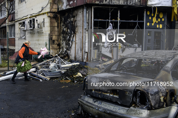 Experts inspect the site of a Russian drone strike in Kyiv, Ukraine, on October 29, 2024 