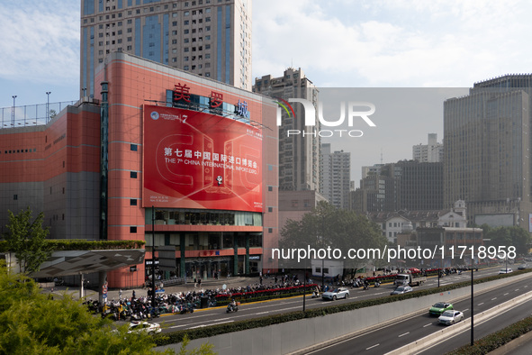 A poster for the 7th China International Import Expo is seen on a building in Shanghai, China, on October 29, 2024. 