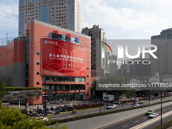 A poster for the 7th China International Import Expo is seen on a building in Shanghai, China, on October 29, 2024. (