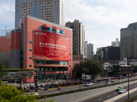 A poster for the 7th China International Import Expo is seen on a building in Shanghai, China, on October 29, 2024. (