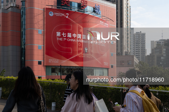 A poster for the 7th China International Import Expo is seen on a building in Shanghai, China, on October 29, 2024. 