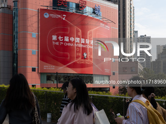 A poster for the 7th China International Import Expo is seen on a building in Shanghai, China, on October 29, 2024. (