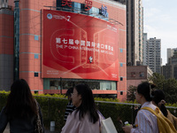 A poster for the 7th China International Import Expo is seen on a building in Shanghai, China, on October 29, 2024. (