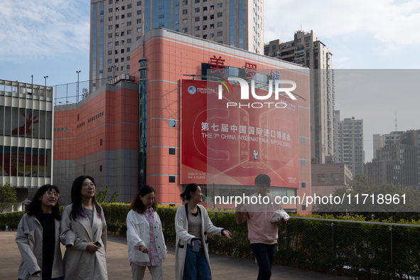 A poster for the 7th China International Import Expo is seen on a building in Shanghai, China, on October 29, 2024. 