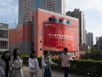 A poster for the 7th China International Import Expo is seen on a building in Shanghai, China, on October 29, 2024. (