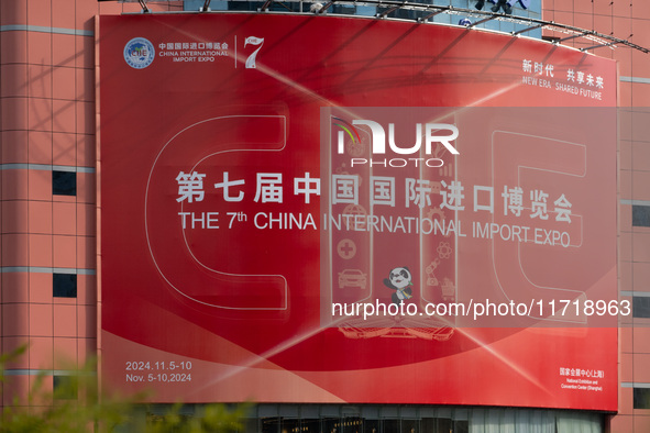 A poster for the 7th China International Import Expo is seen on a building in Shanghai, China, on October 29, 2024. 