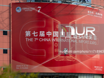 A poster for the 7th China International Import Expo is seen on a building in Shanghai, China, on October 29, 2024. (