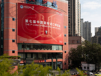 A poster for the 7th China International Import Expo is seen on a building in Shanghai, China, on October 29, 2024. (