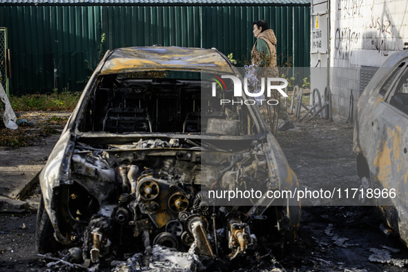 Cars burn down after a Russian drone strike in Kyiv, Ukraine, on October 29, 2024 