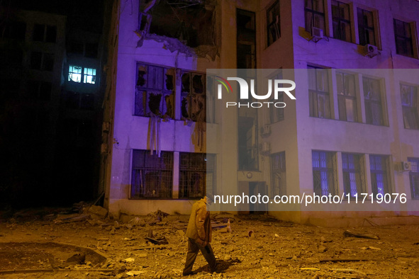 A man walks past the 1930s Derzhprom building damaged by a Russian guided bomb in central Kharkiv, Ukraine, on October 28, 2024. NO USE RUSS...