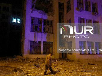 A man walks past the 1930s Derzhprom building damaged by a Russian guided bomb in central Kharkiv, Ukraine, on October 28, 2024. NO USE RUSS...