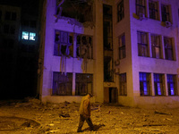 A man walks past the 1930s Derzhprom building damaged by a Russian guided bomb in central Kharkiv, Ukraine, on October 28, 2024. NO USE RUSS...