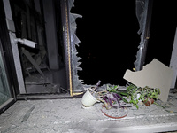 Plants sit on the windowsill of a shattered window in the 1930s Derzhprom building, which is damaged by a Russian guided bomb in central Kha...