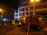 Rescuers and a fire engine are outside the 1930s Derzhprom building damaged by a Russian guided bomb in central Kharkiv, Ukraine, on October...