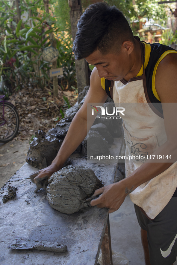 A man creates ceramic art typical of Marajo Island, located at the mouth of the Amazon River and considered the largest fluvial-maritime isl...