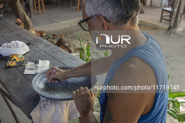 A man creates ceramic art typical of Marajo Island, located at the mouth of the Amazon River and considered the largest fluvial-maritime isl...