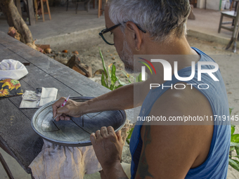 A man creates ceramic art typical of Marajo Island, located at the mouth of the Amazon River and considered the largest fluvial-maritime isl...