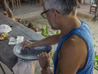 A man creates ceramic art typical of Marajo Island, located at the mouth of the Amazon River and considered the largest fluvial-maritime isl...